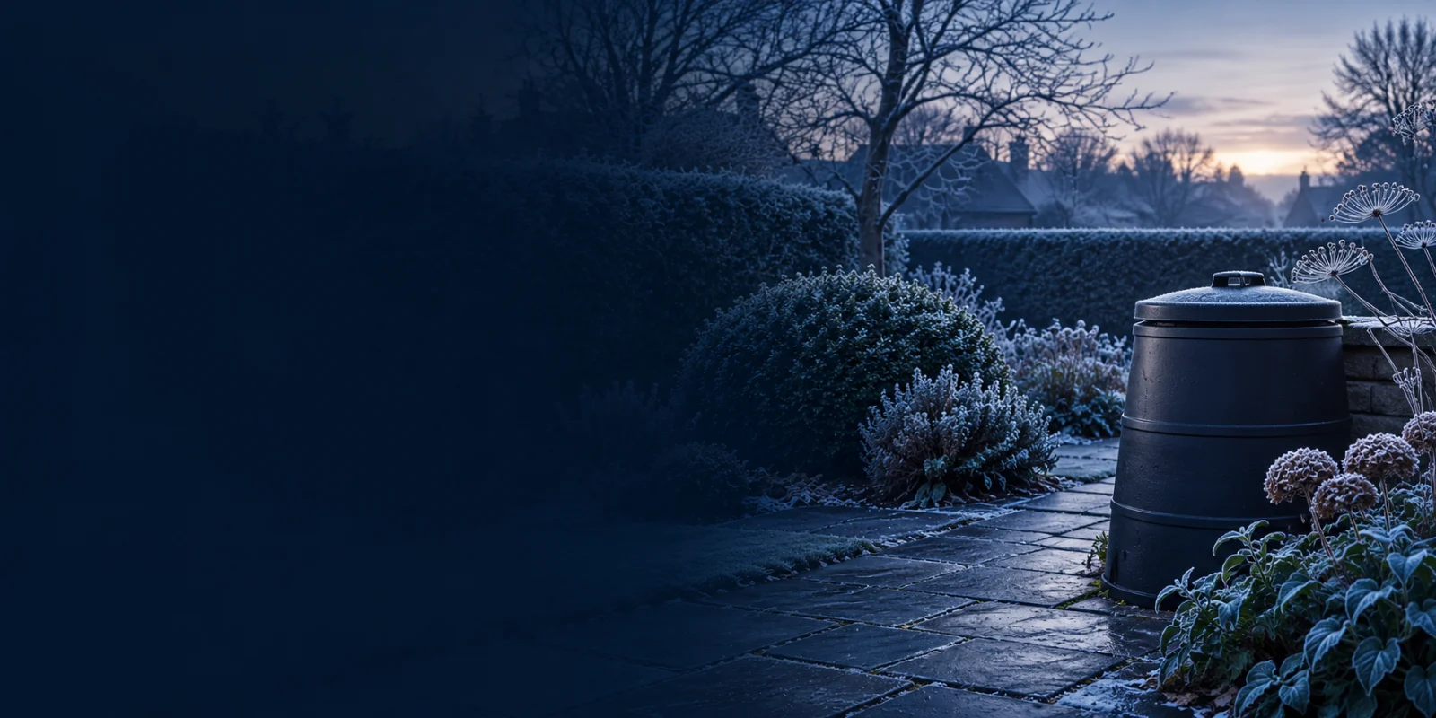 Illustration of a frosty garden with an unbranded compost bin; not a product performance demonstration.